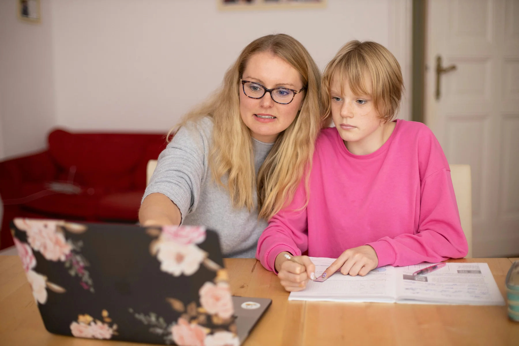 An adult helping a child understand a lesson