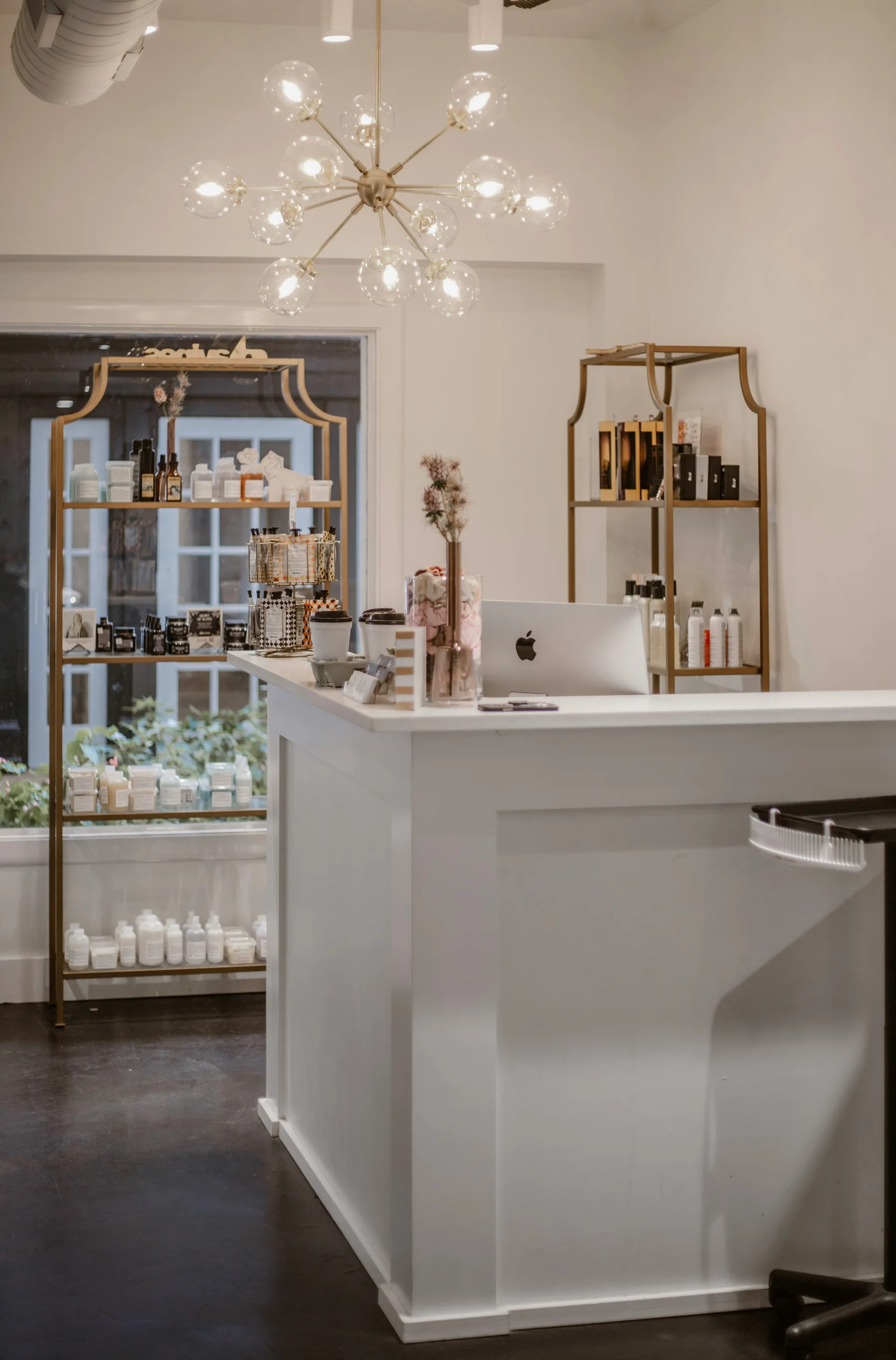 A calm salon reception with warm gold details